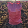 Red woven bags for packing potatoes